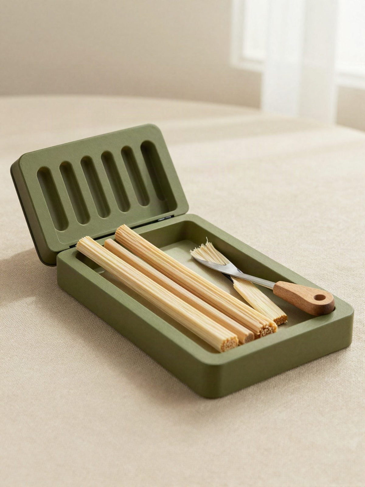 A siwak kit with a ventilated case, natural sticks and a tip cutter